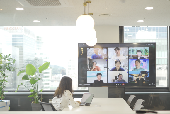 Employees of Haru Invest attending a video conference